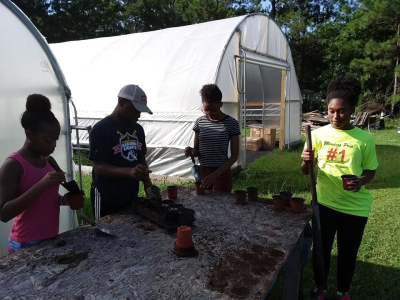 Youth planting and gardening